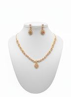Ringing Jewels Golden Colour with Pink Stones Single Layer "AD" Necklace Set With Earrings