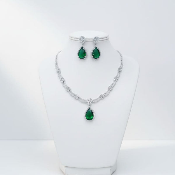 Ringing Jewels White Colour with Green Bold Stone 