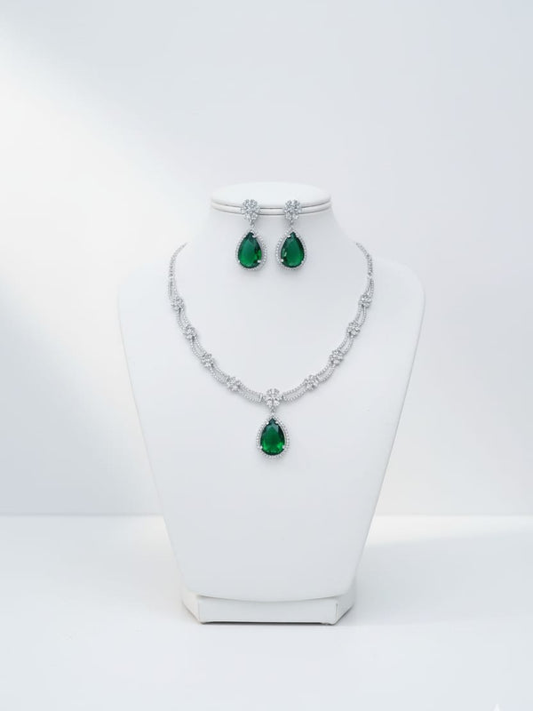 Ringing Jewels White Colour with Green Bold Stone 