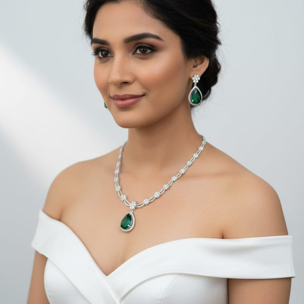 Ringing Jewels White Colour with Green Bold Stone 