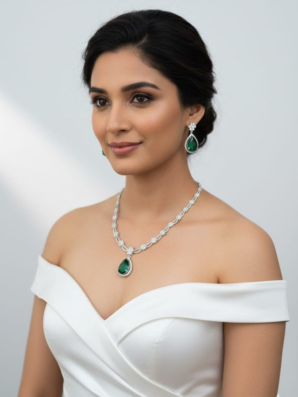 Ringing Jewels White Colour with Green Bold Stone 