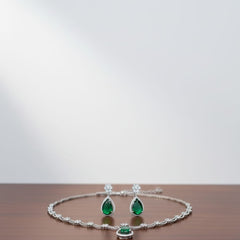 Ringing Jewels White Colour with Green Bold Stone 